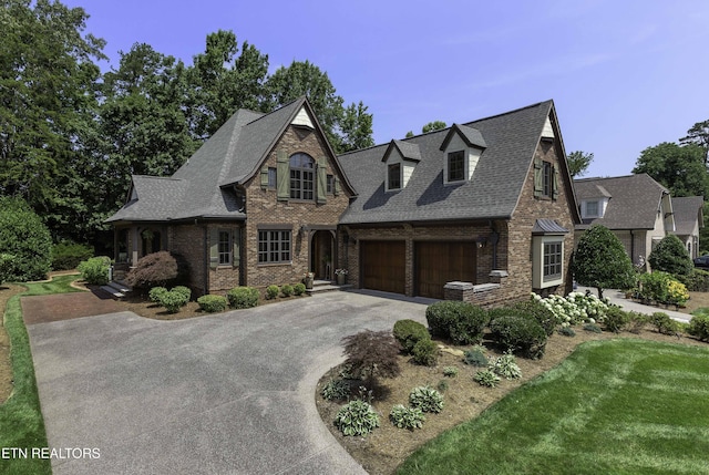 11211 Matthews Cove Ln, Knoxville, TN 37934 - view of front of house featuring driveway, brick siding, an attached garage, and a shingled roof