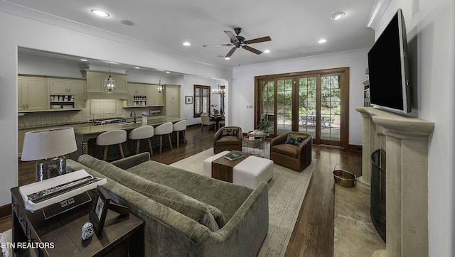 11211 Matthews Cove Ln, Knoxville, TN 37934 - living area with wood finished floors, ornamental molding, ceiling fan, and recessed lighting