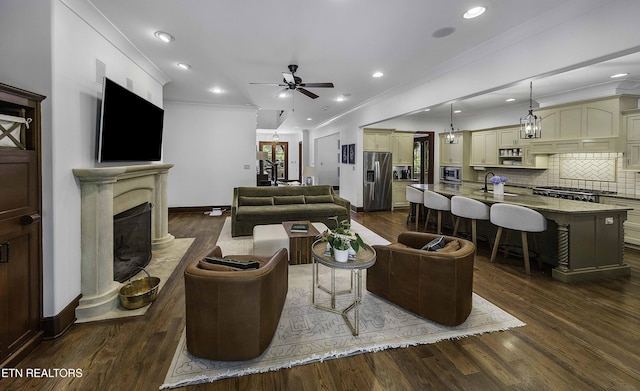 11211 Matthews Cove Ln, Knoxville, TN 37934 - living area featuring ornamental molding, dark wood finished floors, ceiling fan, a premium fireplace, and recessed lighting