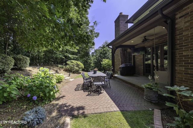11211 Matthews Cove Ln, Knoxville, TN 37934 - view of patio / terrace featuring outdoor dining space, a ceiling fan, and area for grilling