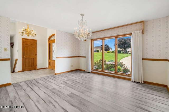 136 Oostagala Dr, Loudon, TN 37774 - unfurnished dining area with a chandelier, wallpapered walls, healthy amount of natural light, and wood finished floors