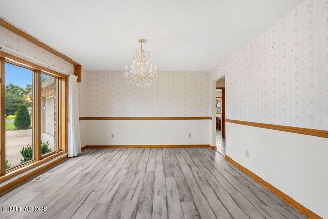 136 Oostagala Dr, Loudon, TN 37774 - spare room with a chandelier, wood finished floors, and wallpapered walls