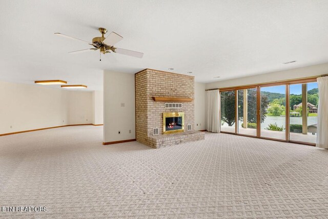 136 Oostagala Dr, Loudon, TN 37774 - unfurnished living room featuring carpet floors, ceiling fan, and a fireplace