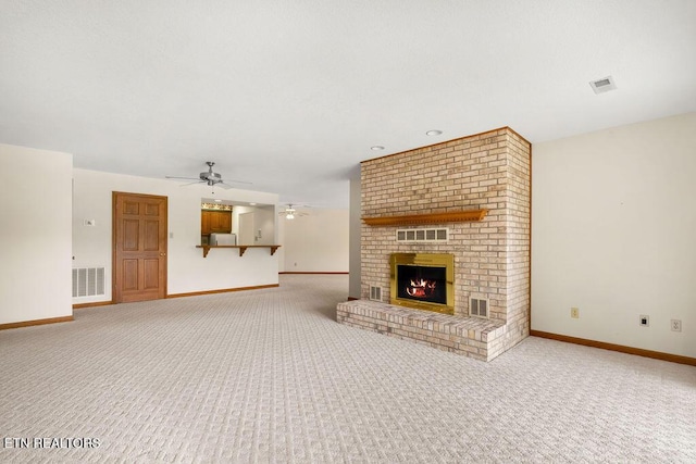 136 Oostagala Dr, Loudon, TN 37774 - unfurnished living room with light carpet, a ceiling fan, and a fireplace