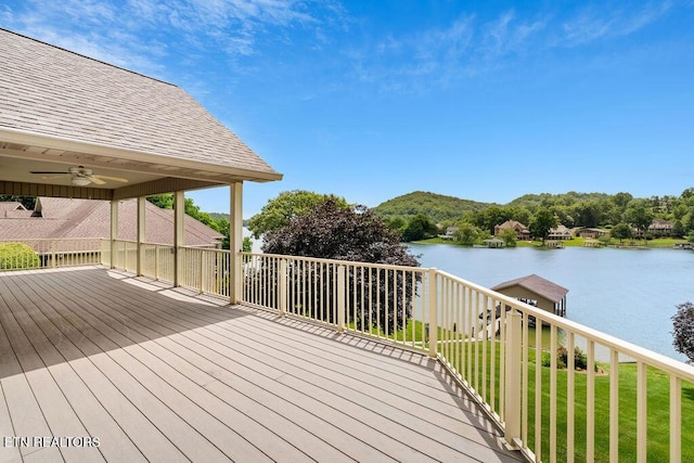 136 Oostagala Dr, Loudon, TN 37774 - wooden terrace featuring a water view, a ceiling fan, and a lawn