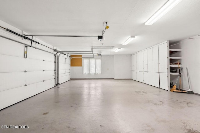 136 Oostagala Dr, Loudon, TN 37774 - garage featuring a garage door opener