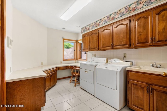 136 Oostagala Dr, Loudon, TN 37774 - washroom featuring cabinet space, independent washer and dryer, light tile patterned flooring, and a desk