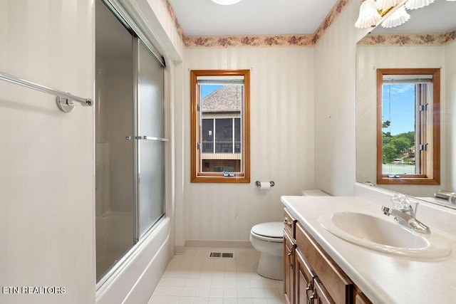 136 Oostagala Dr, Loudon, TN 37774 - full bathroom featuring tile patterned flooring, vanity, plenty of natural light, and combined bath / shower with glass door