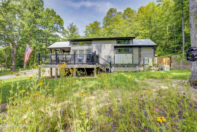 1429 Alpine Dr, Sevierville, TN 37876 - back of house featuring a wooden deck and a metal roof