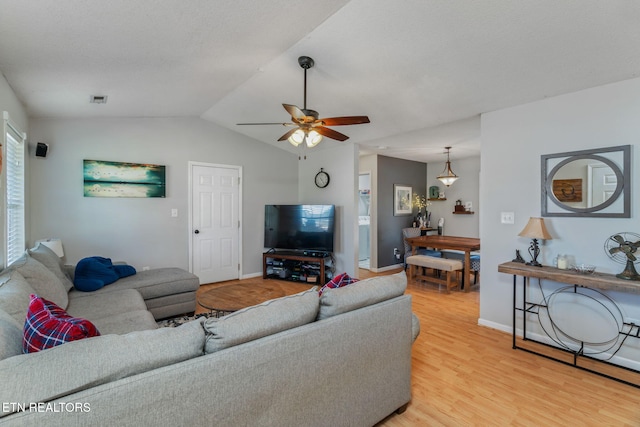 7527 Wheatmeadow Rd, Corryton, TN 37721 - living room featuring light wood finished floors, a ceiling fan, and vaulted ceiling