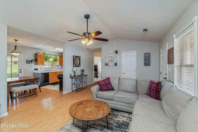 7527 Wheatmeadow Rd, Corryton, TN 37721 - living room featuring light wood-type flooring, ceiling fan, and vaulted ceiling