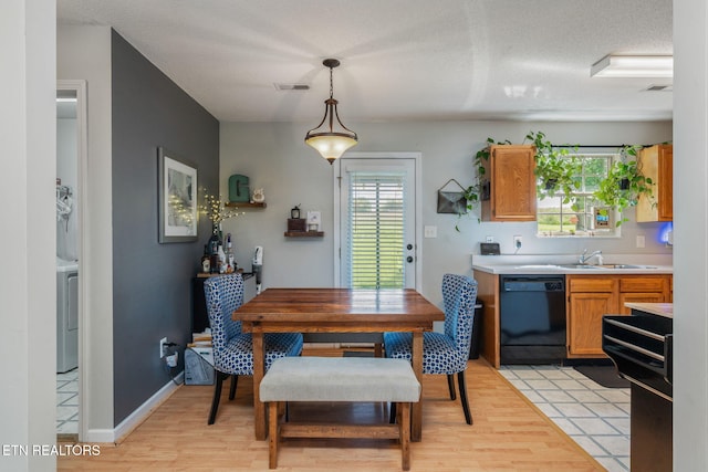 7527 Wheatmeadow Rd, Corryton, TN 37721 - dining space featuring washer / clothes dryer and light wood-type flooring