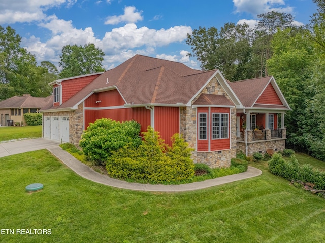 135 Chanusi Way, Loudon, TN 37774 - view of front of home featuring stone siding, concrete driveway, a front lawn, and a shingled roof