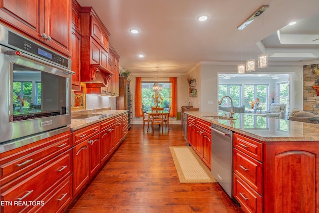 135 Chanusi Way, Loudon, TN 37774 - kitchen with appliances with stainless steel finishes, dark wood-style floors, crown molding, hanging light fixtures, and dark brown cabinets