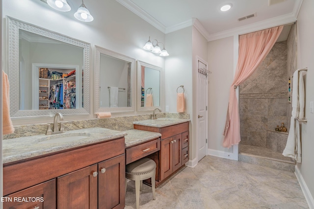 135 Chanusi Way, Loudon, TN 37774 - full bath with double vanity, a tile shower, crown molding, and a walk in closet