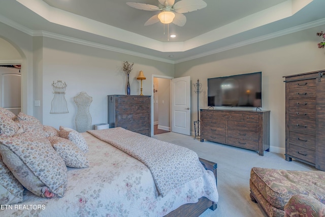 135 Chanusi Way, Loudon, TN 37774 - carpeted bedroom with a tray ceiling, arched walkways, crown molding, recessed lighting, and ceiling fan