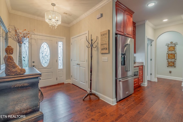 135 Chanusi Way, Loudon, TN 37774 - entrance foyer with dark wood-style floors, ornamental molding, a chandelier, recessed lighting, and arched walkways