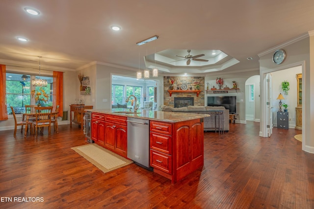 135 Chanusi Way, Loudon, TN 37774 - kitchen with stainless steel dishwasher, dark brown cabinets, a stone fireplace, a ceiling fan, and ornamental molding