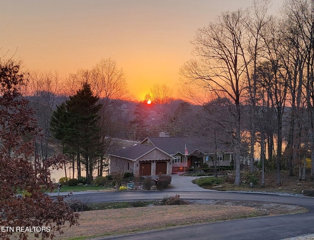 135 Chanusi Way, Loudon, TN 37774 - view of front of property featuring driveway, a chimney, and a garage