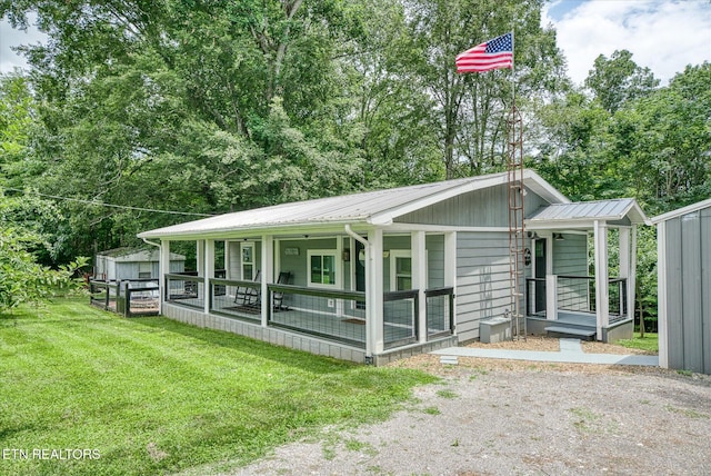 502 Midnight Dr, Byrdstown, TN 38549 - view of front of property with a front lawn, a metal roof, and covered porch