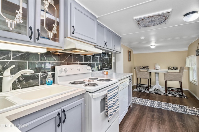502 Midnight Dr, Byrdstown, TN 38549 - kitchen with white appliances, range hood, backsplash, and dark wood finished floors