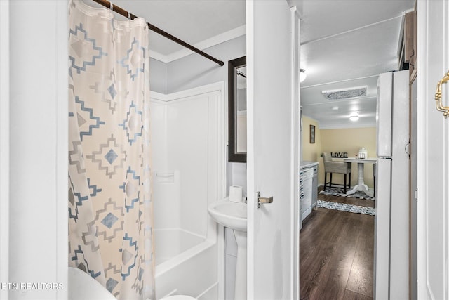 502 Midnight Dr, Byrdstown, TN 38549 - bathroom with ornamental molding, wood finished floors, and shower / tub combo