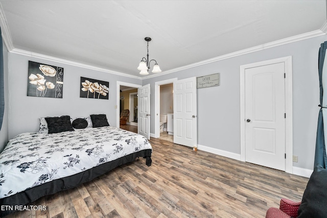 502 Midnight Dr, Byrdstown, TN 38549 - bedroom with crown molding, wood finished floors, and a chandelier