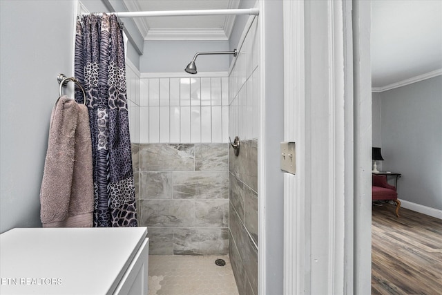 502 Midnight Dr, Byrdstown, TN 38549 - bathroom featuring ornamental molding, a tile shower, and wood finished floors