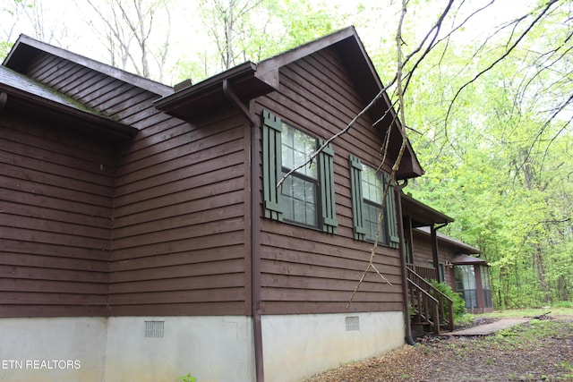 108 Laurel Dr, Jamestown, TN 38556 - view of side of home featuring crawl space and a view of trees