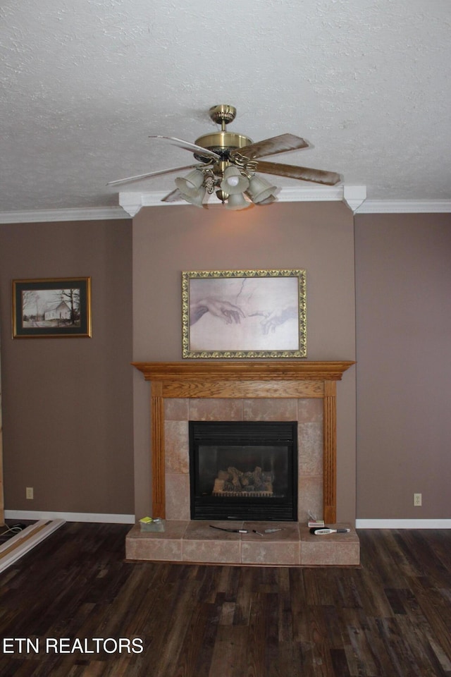 108 Laurel Dr, Jamestown, TN 38556 - detailed view of a tile fireplace, wood finished floors, a ceiling fan, a textured ceiling, and ornamental molding