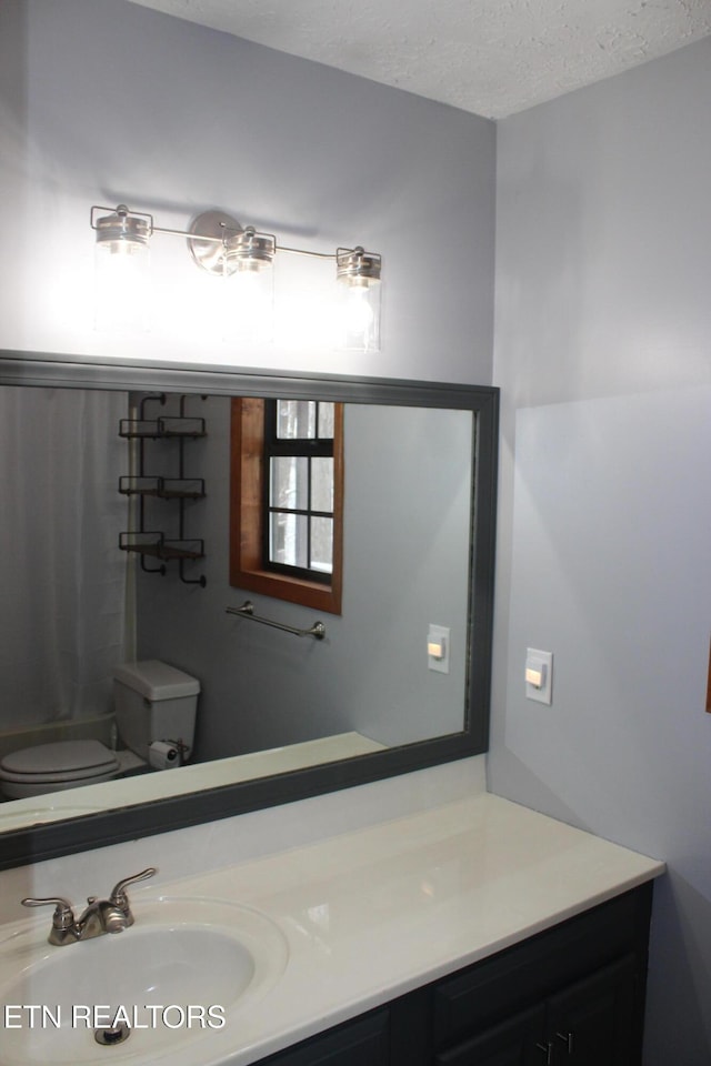 108 Laurel Dr, Jamestown, TN 38556 - bathroom featuring a textured ceiling and vanity