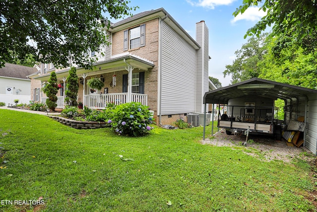 7110 Royal Springs Blvd, Knoxville, TN 37918 - view of front facade with a detached carport, a porch, a front lawn, and a chimney