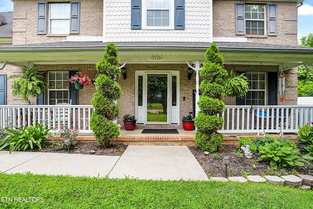 7110 Royal Springs Blvd, Knoxville, TN 37918 - doorway to property with a porch and brick siding