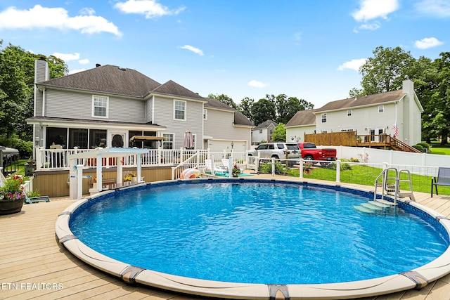 7110 Royal Springs Blvd, Knoxville, TN 37918 - view of pool with a wooden deck, a sunroom, and a residential view