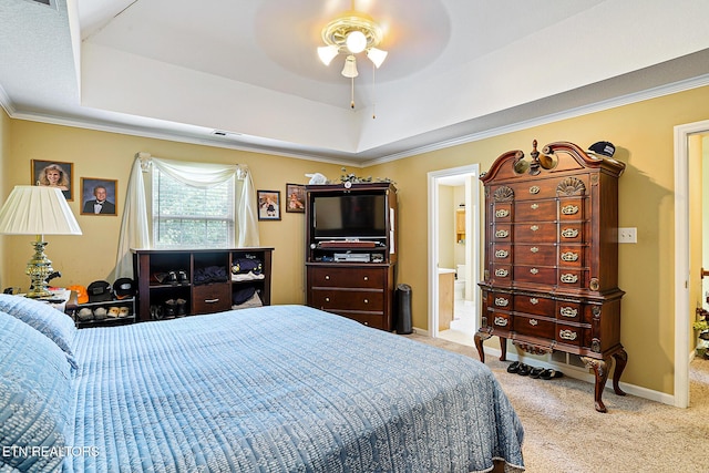 7110 Royal Springs Blvd, Knoxville, TN 37918 - carpeted bedroom featuring a tray ceiling, ornamental molding, a ceiling fan, and ensuite bathroom