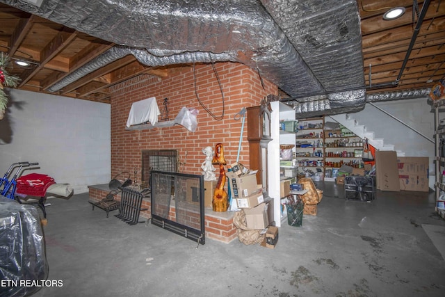 506 Blockhouse Valley Rd, Clinton, TN 37716 - unfurnished living room featuring unfinished concrete flooring, a fireplace, and stairway