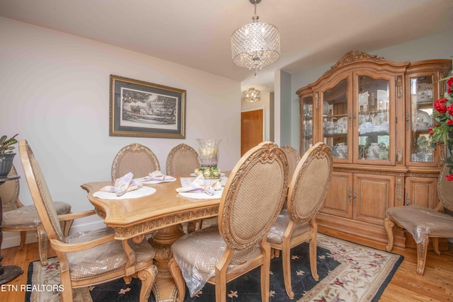 506 Blockhouse Valley Rd, Clinton, TN 37716 - dining room featuring light wood finished floors and a chandelier