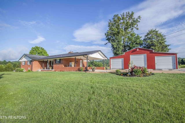 506 Blockhouse Valley Rd, Clinton, TN 37716 - view of grassy yard with a detached garage, an outbuilding, and driveway