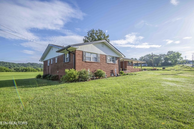 506 Blockhouse Valley Rd, Clinton, TN 37716 - view of home's exterior with brick siding and a lawn