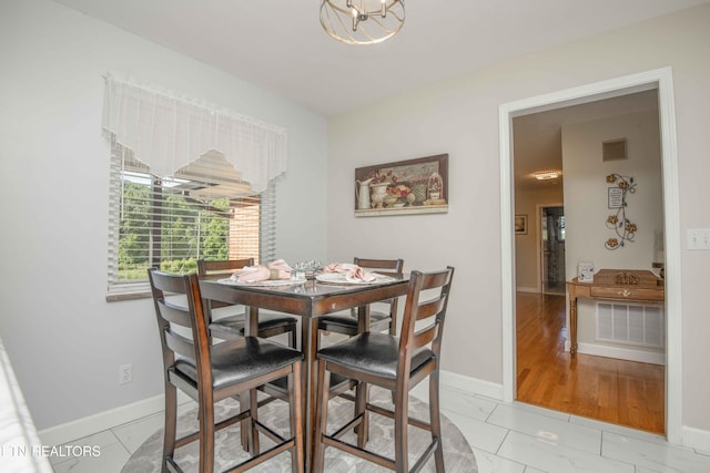 506 Blockhouse Valley Rd, Clinton, TN 37716 - dining space with a chandelier and light marble finish flooring