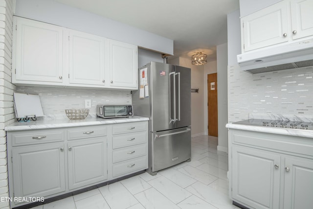 506 Blockhouse Valley Rd, Clinton, TN 37716 - kitchen with high end refrigerator, under cabinet range hood, black electric stovetop, light marble finish floors, and light countertops