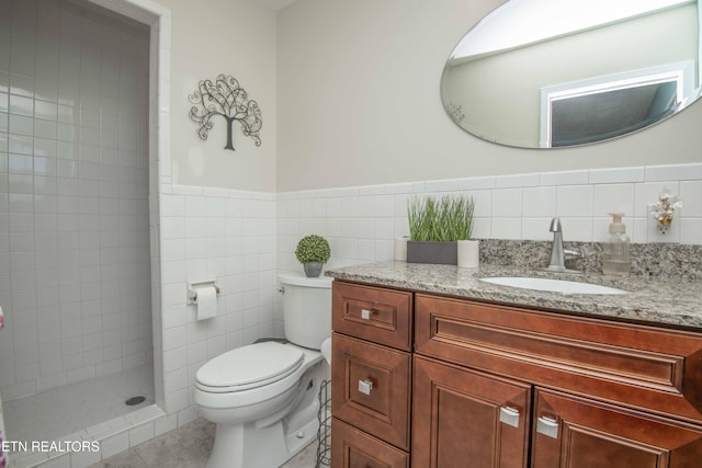 506 Blockhouse Valley Rd, Clinton, TN 37716 - full bath featuring vanity, tiled shower, a wainscoted wall, tile walls, and tile patterned flooring