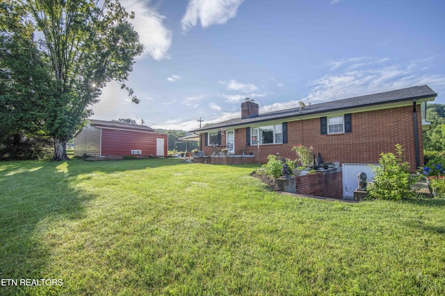 506 Blockhouse Valley Rd, Clinton, TN 37716 - rear view of house with brick siding, a chimney, and a yard