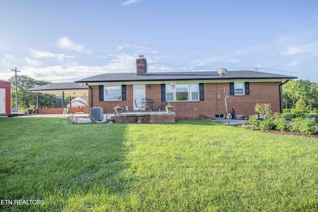 506 Blockhouse Valley Rd, Clinton, TN 37716 - back of house featuring a chimney, a yard, and brick siding