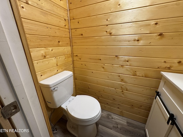 109 Henry Mayfield Rd, Tellico Plains, TN 37385 - bathroom featuring vanity, wood finished floors, and wooden walls