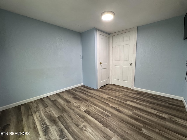 109 Henry Mayfield Rd, Tellico Plains, TN 37385 - unfurnished bedroom featuring dark wood-type flooring and baseboards