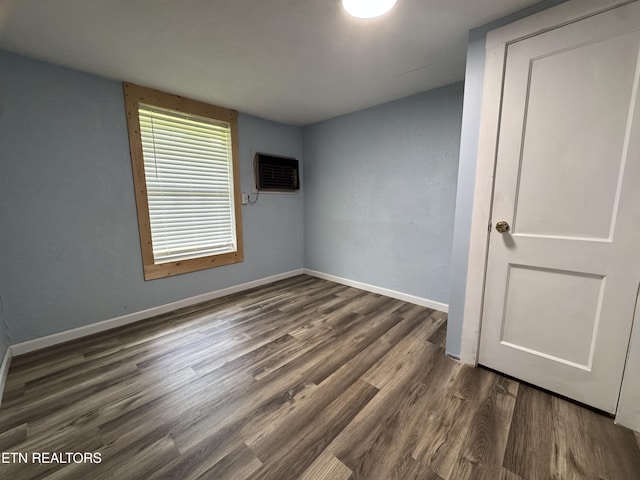 109 Henry Mayfield Rd, Tellico Plains, TN 37385 - spare room with dark wood-style flooring and a wall unit AC