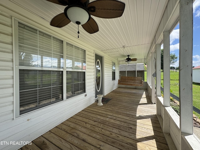 109 Henry Mayfield Rd, Tellico Plains, TN 37385 - wooden porch with a ceiling fan