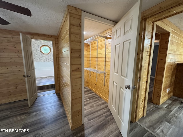 109 Henry Mayfield Rd, Tellico Plains, TN 37385 - hall with wood walls, wood finished floors, and a textured ceiling