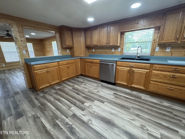 109 Henry Mayfield Rd, Tellico Plains, TN 37385 - kitchen featuring dishwasher, light wood-style floors, brown cabinets, recessed lighting, and wooden walls